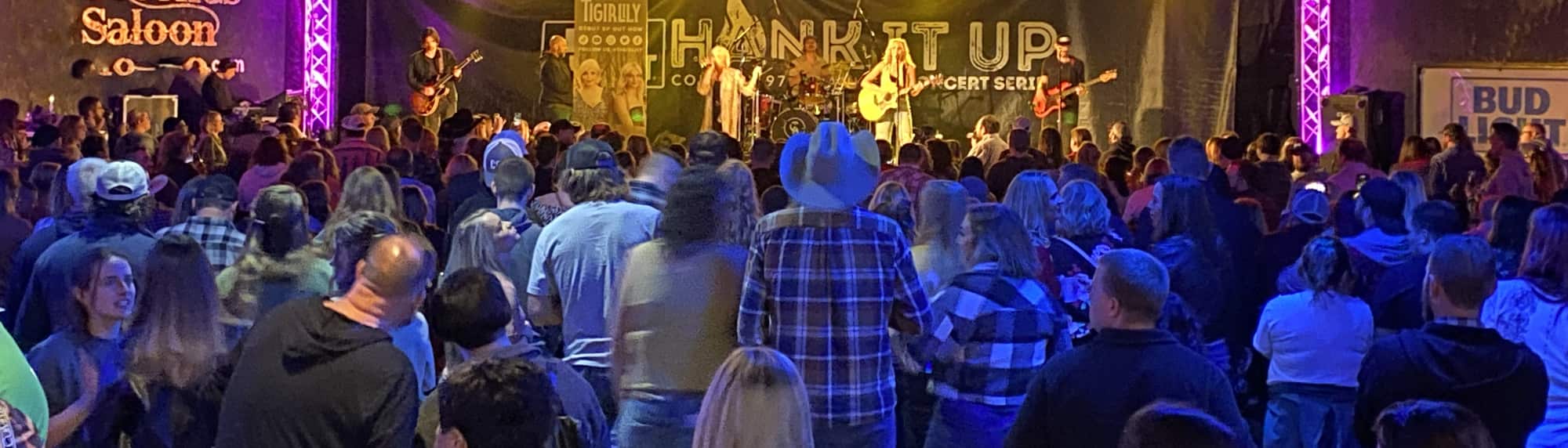 country concert with fans wearing cowboy hats Tucson